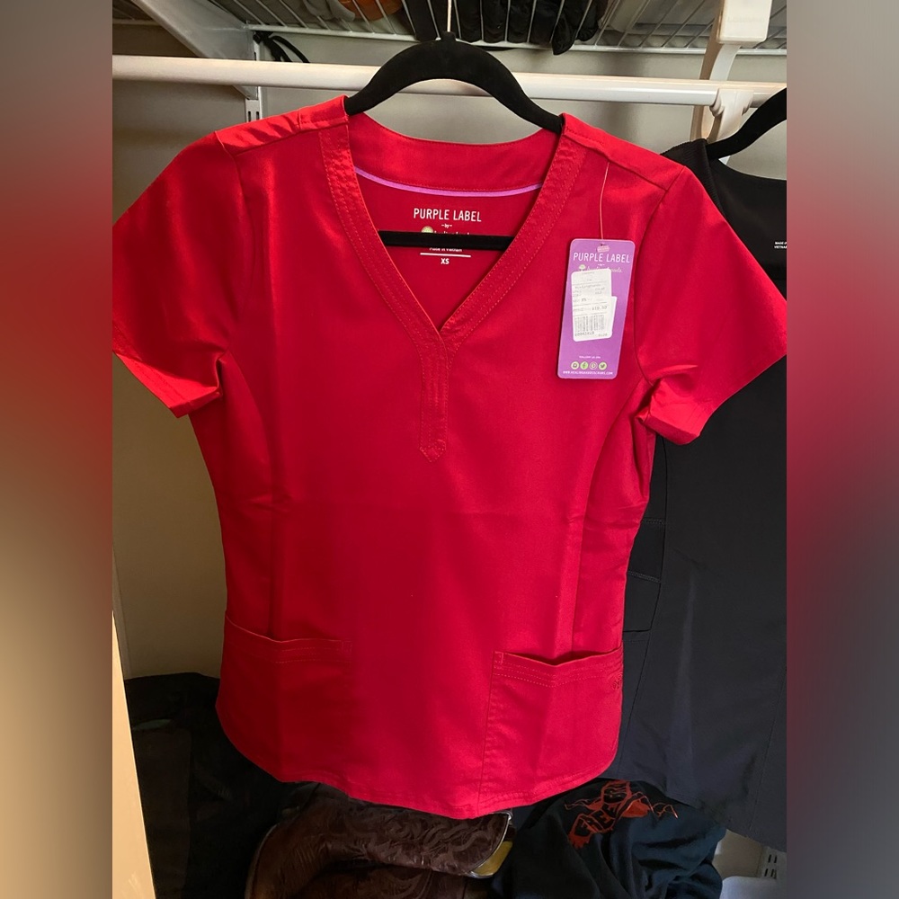 Red Scrub top, new with tags . Very flattering!